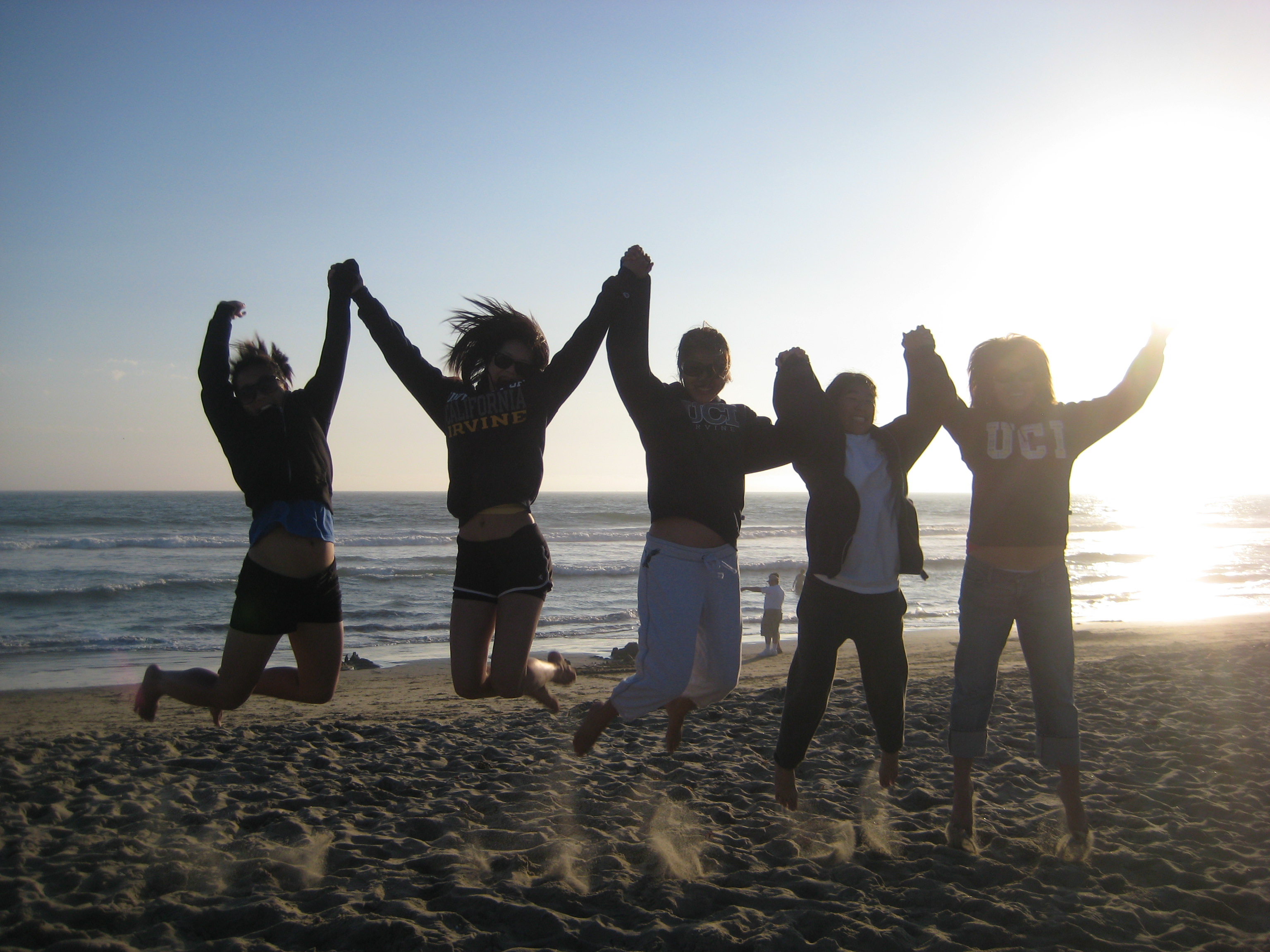 Christina Treble and friends at a previous Campuswide Honors Program bonfire night at Corona del Mar.