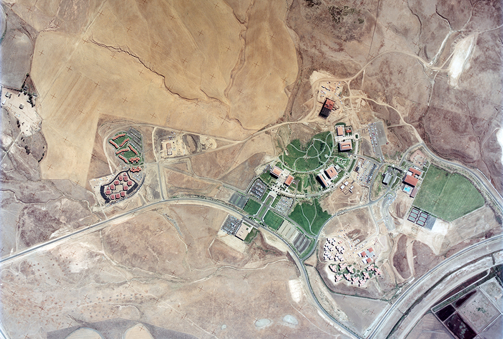 An aerial photograph taken of UCI in 1967 shows the budding campus under development. Image provided by AS-056. Early Campus Photograph Album. Special Collections & Archives, the UCI Libraries, Irvine, California.